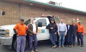 Seven member of GWSD staff standing infront of a pickup