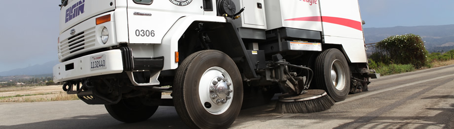 Street Sweeper sweeping side of road