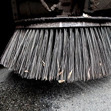 Closeup of street sweeper brush